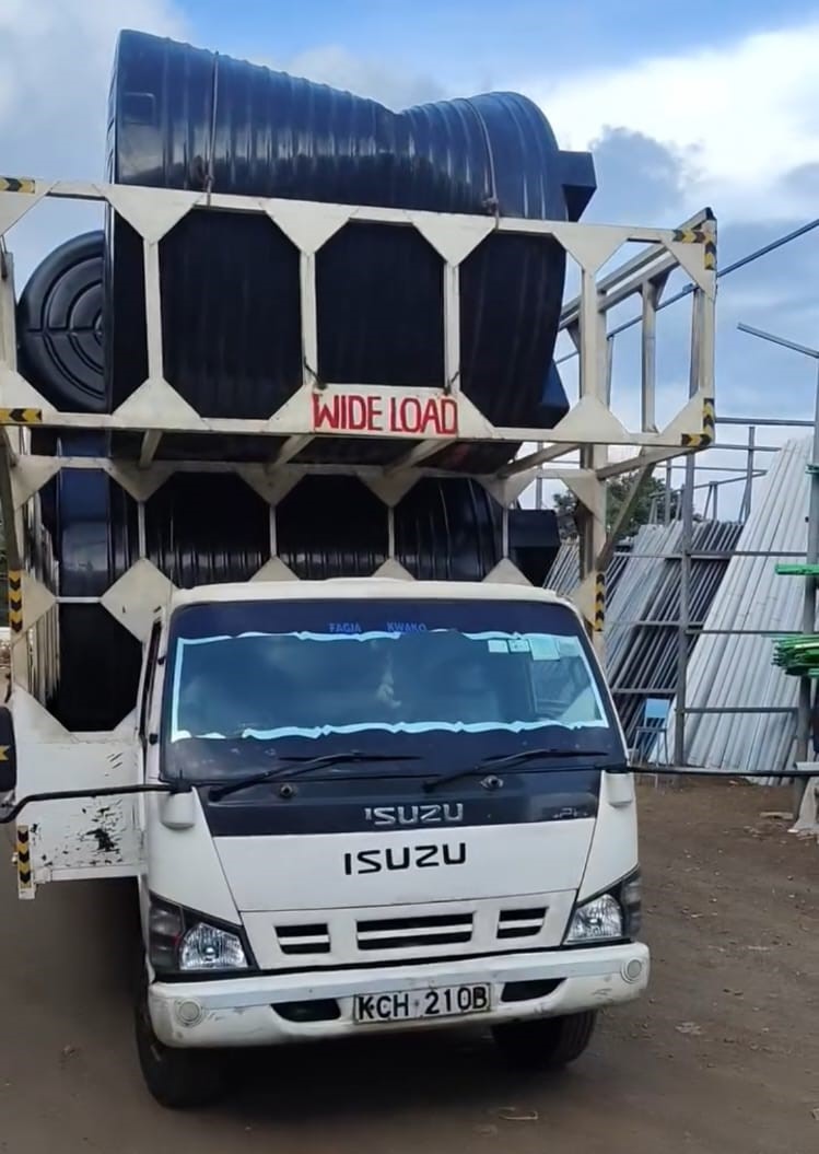 Professional technicians installing water tank system
